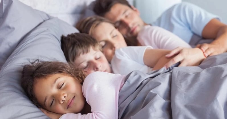 Family of four sleeping